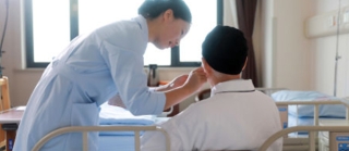 a man and a nurse in a hospital